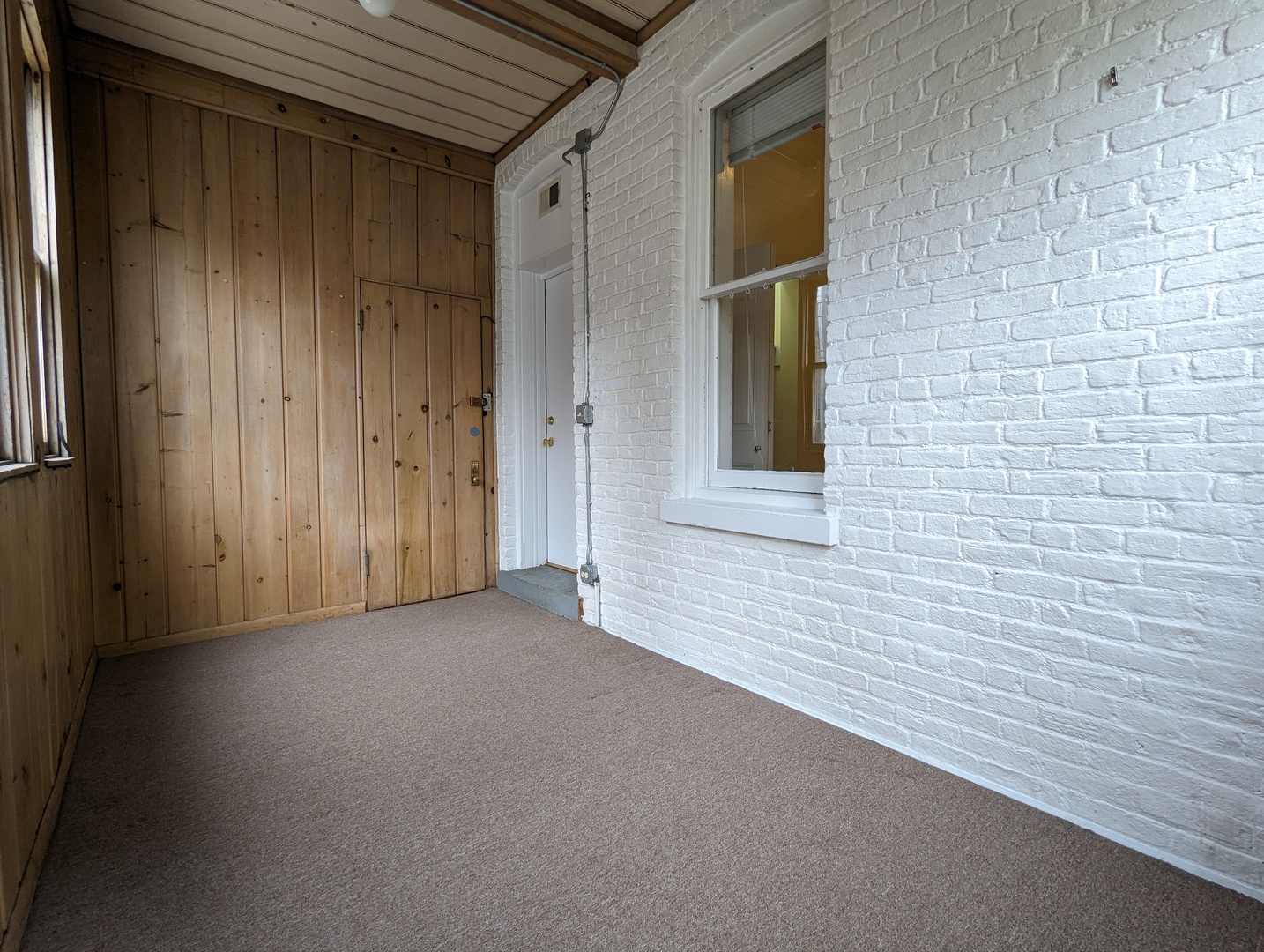 2134 West Concord Place, Unit 1R Chicago, IL 60647 - Photo 17 of 18 a view of an empty room with window and wooden floor