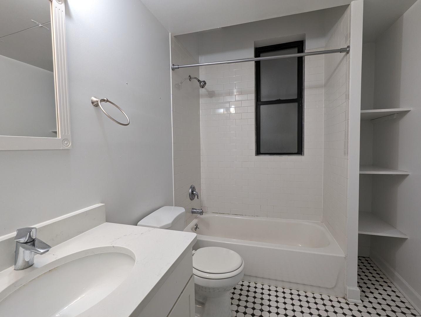 2134 West Concord Place, Unit 1R Chicago, IL 60647 - Photo 6 of 18 a bathroom with a sink toilet and shower