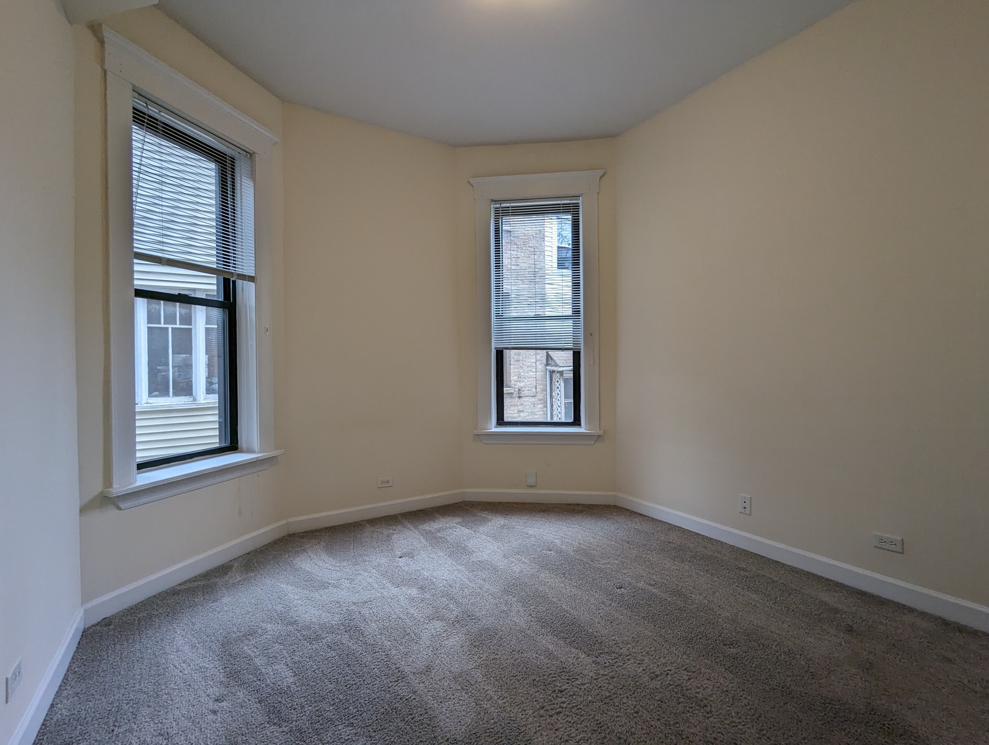 2134 West Concord Place, Unit 1R Chicago, IL 60647 - Photo 8 of 18 an empty room with windows