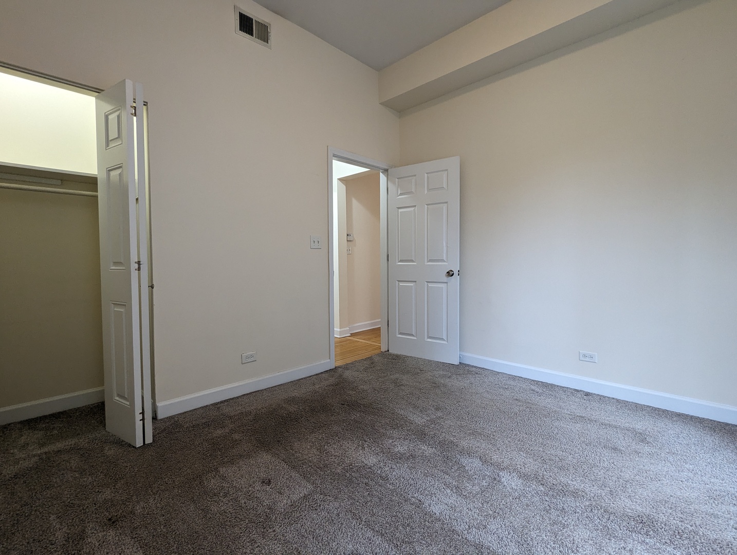 2134 West Concord Place, Unit 1R Chicago, IL 60647 - Photo 9 of 18 an empty room with closet area