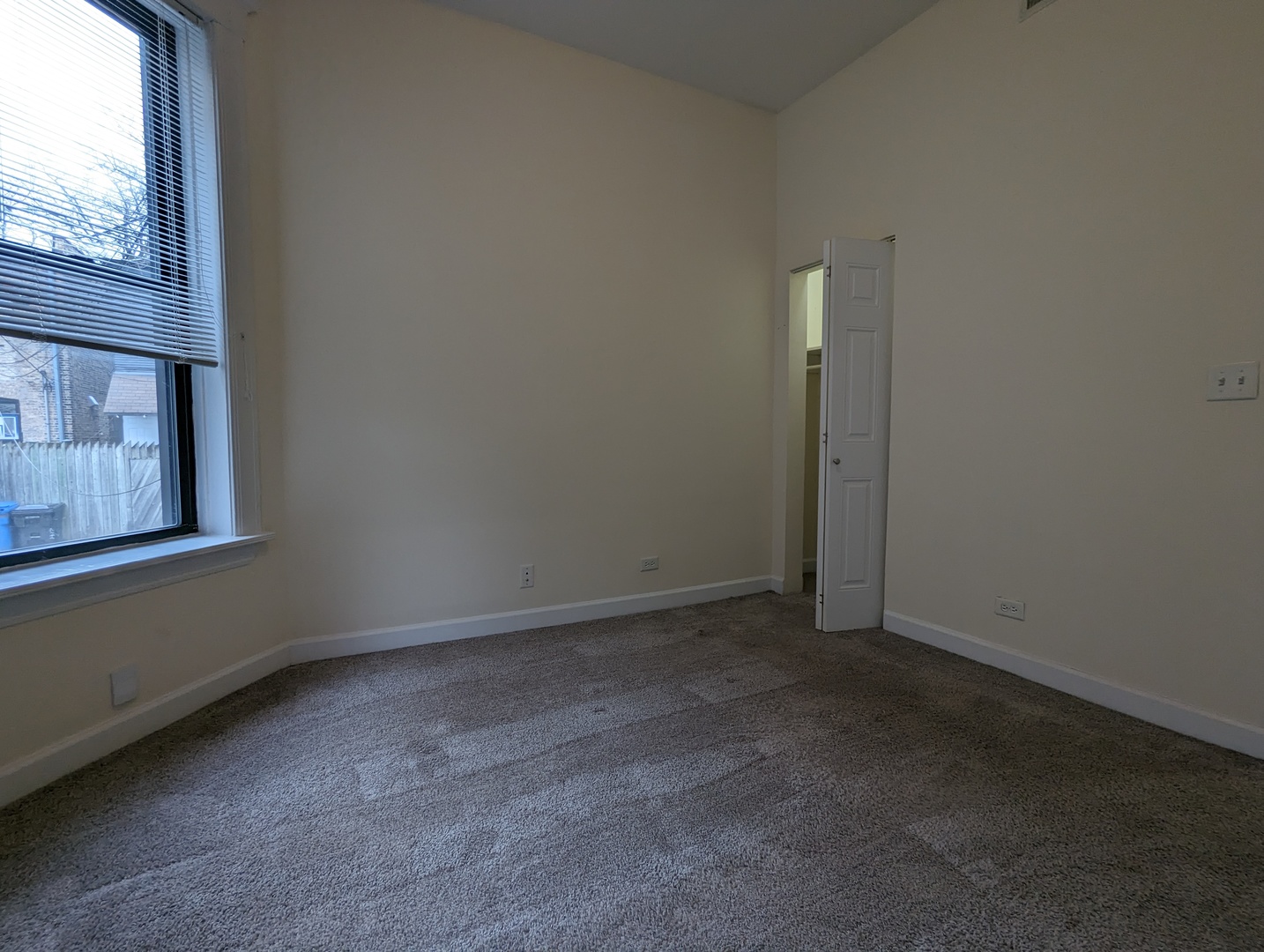 2134 West Concord Place, Unit 1R Chicago, IL 60647 - Photo 10 of 18 a view of an empty room with wooden floor and a window