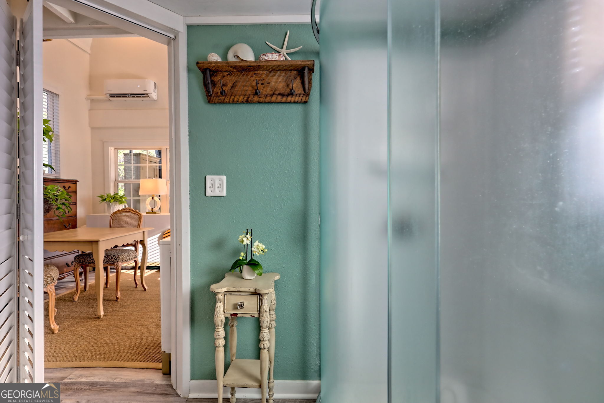 1063 Joe Davis Road Tiger, GA 30576 - Photo 12 of 39 a view of a hallway with dining area wooden floor and a dining table