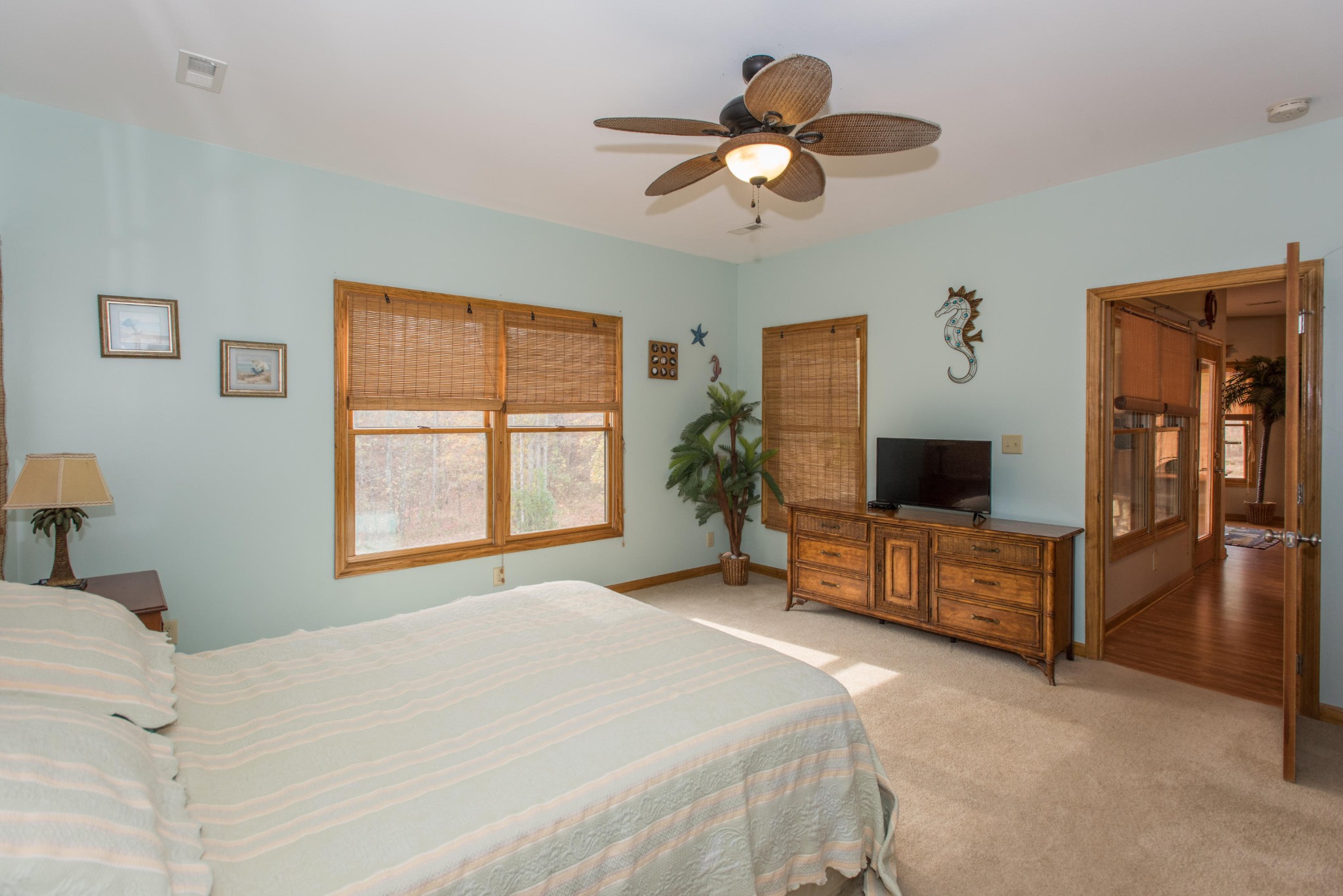 254 Logan Lane Heiskell, TN 37754 - Photo 19 of 39 a bedroom with a large bed a flat tv screen and dresser