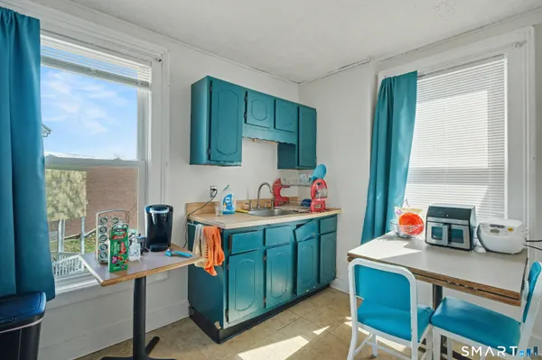 a work place with table and chairs in it