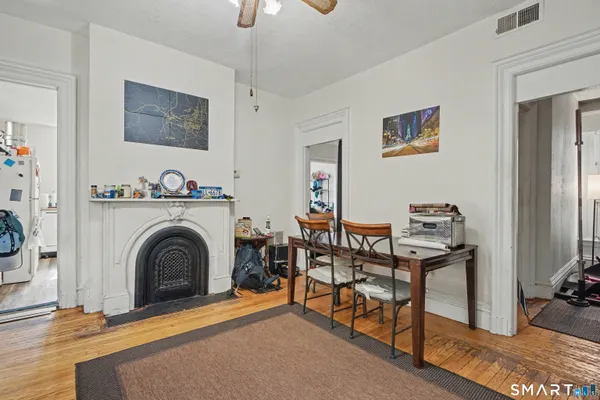 a view of a livingroom with furniture and a fireplace