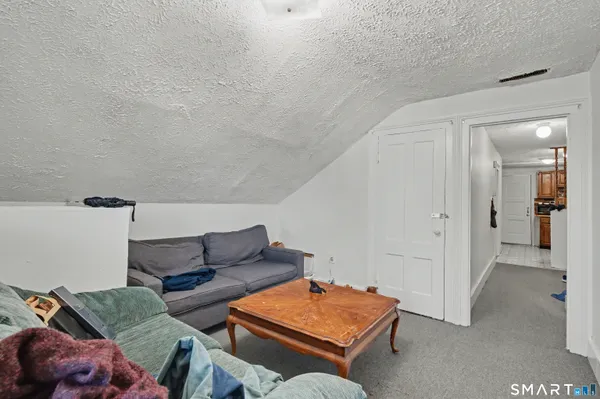 a living room with furniture and a table