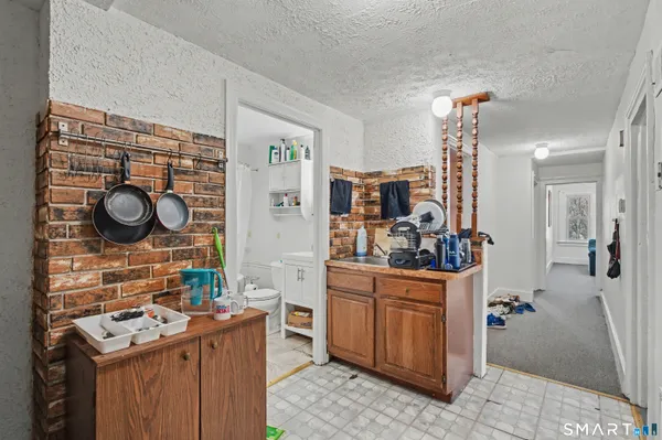 a view of a kitchen and utility room