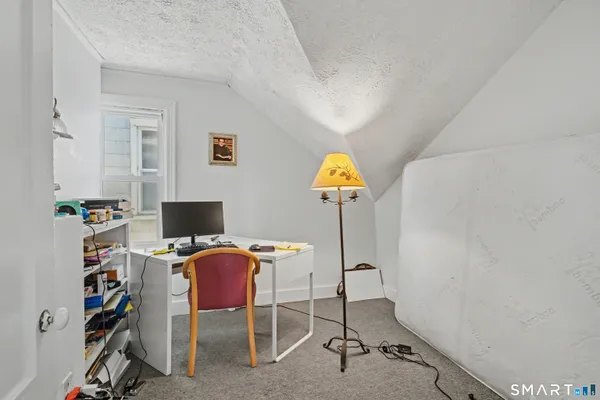 a view of a workspace with furniture