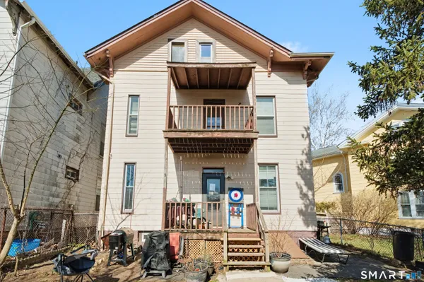 a front view of a house with a small yard