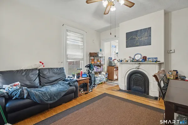 a living room with furniture and a fireplace
