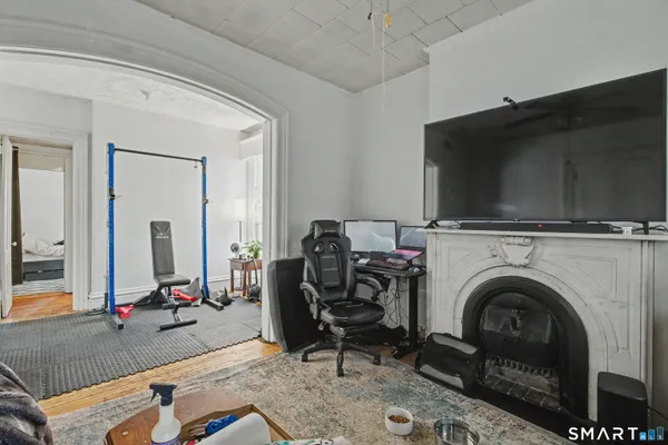 a view of a livingroom with furniture and a fireplace