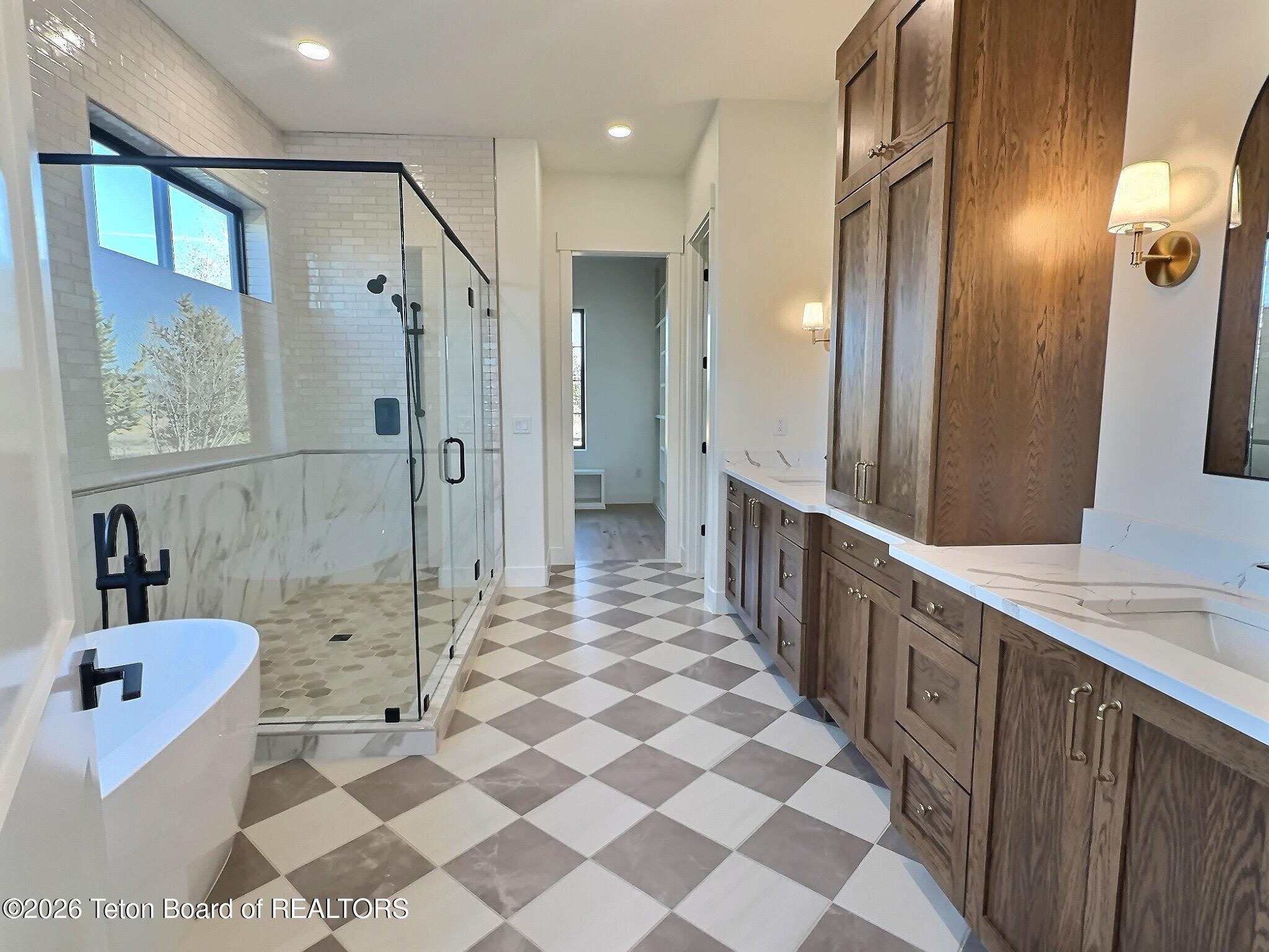 371 Desert Fox Lane Victor, ID 83455 - Photo 26 of 46 primary suite bathroom from bedroom