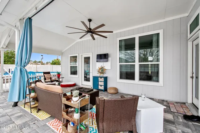 a living room with furniture and a window