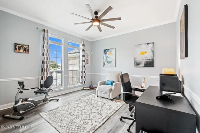 a living room with furniture rug and window