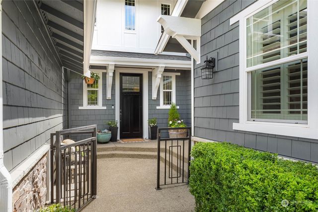 a view of house with backyard