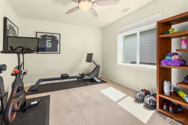 a room with gym equipment and a window