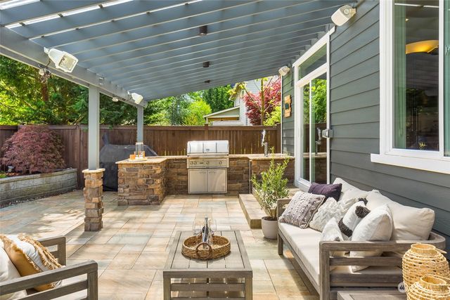 a outdoor space with patio the couches and a dining table with garden view