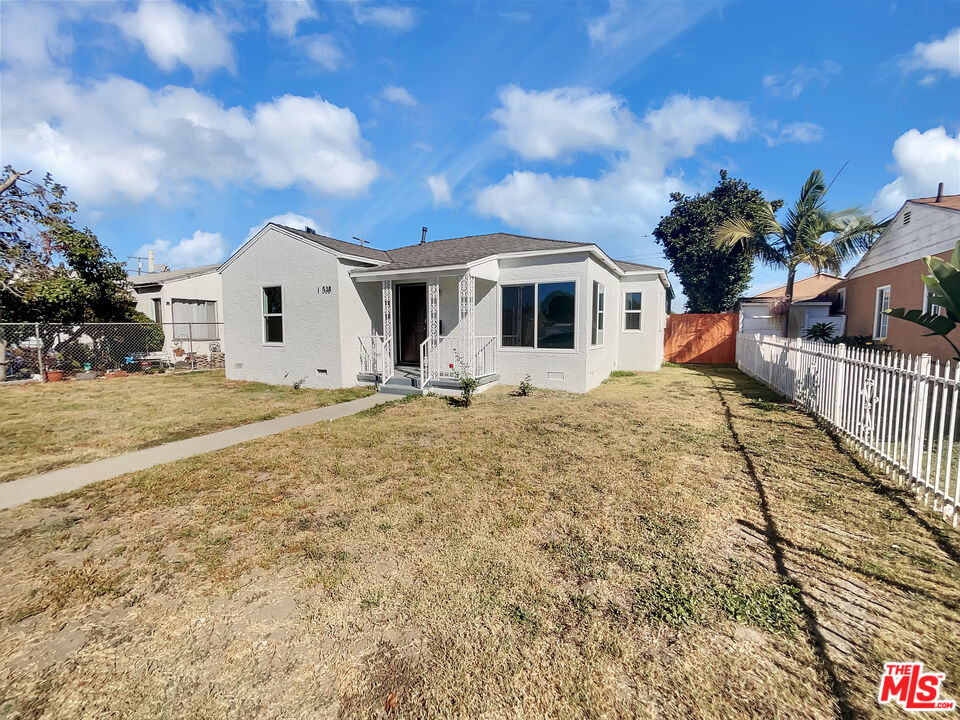 14538 Atlantic Avenue Compton, CA 90221 - Photo 1 of 18 a front view of a house with a yard