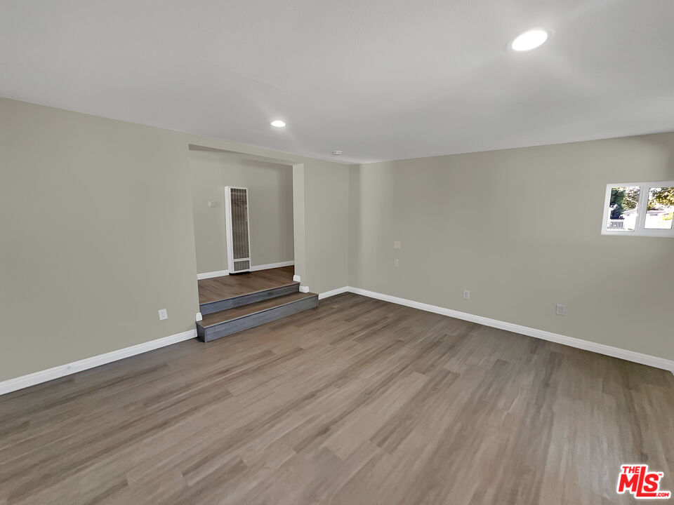 14538 Atlantic Avenue Compton, CA 90221 - Photo 18 of 18 a view of empty room with wooden floor and fan