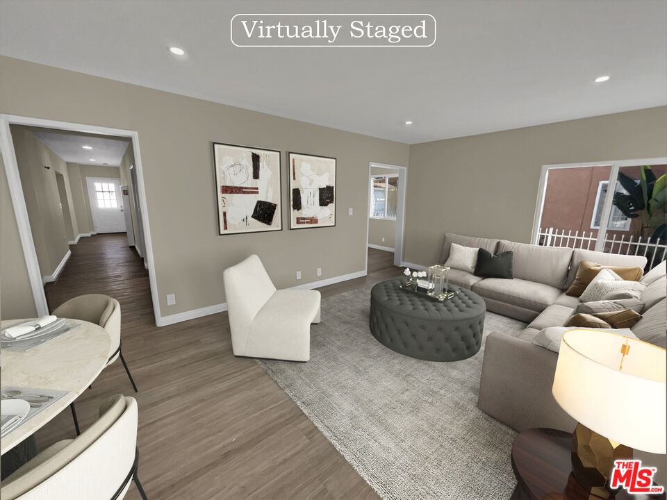 14538 Atlantic Avenue Compton, CA 90221 - Photo 2 of 18 a living room with furniture and wooden floor