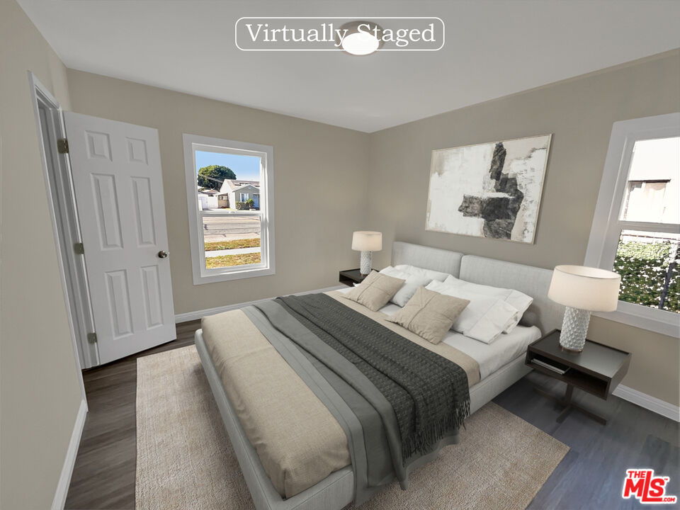 14538 Atlantic Avenue Compton, CA 90221 - Photo 4 of 18 a bedroom with a bed and a window