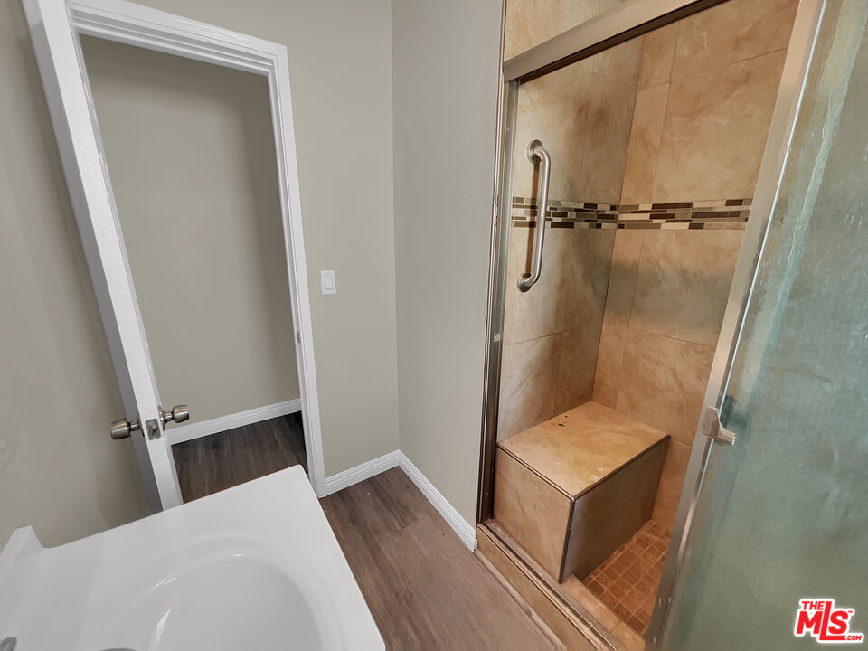 14538 Atlantic Avenue Compton, CA 90221 - Photo 9 of 18 walk in closet with wooden floor