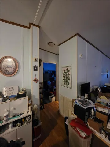 a living room with furniture window and a flat screen tv