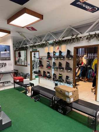 a bedroom with lots of furniture and a flat screen tv