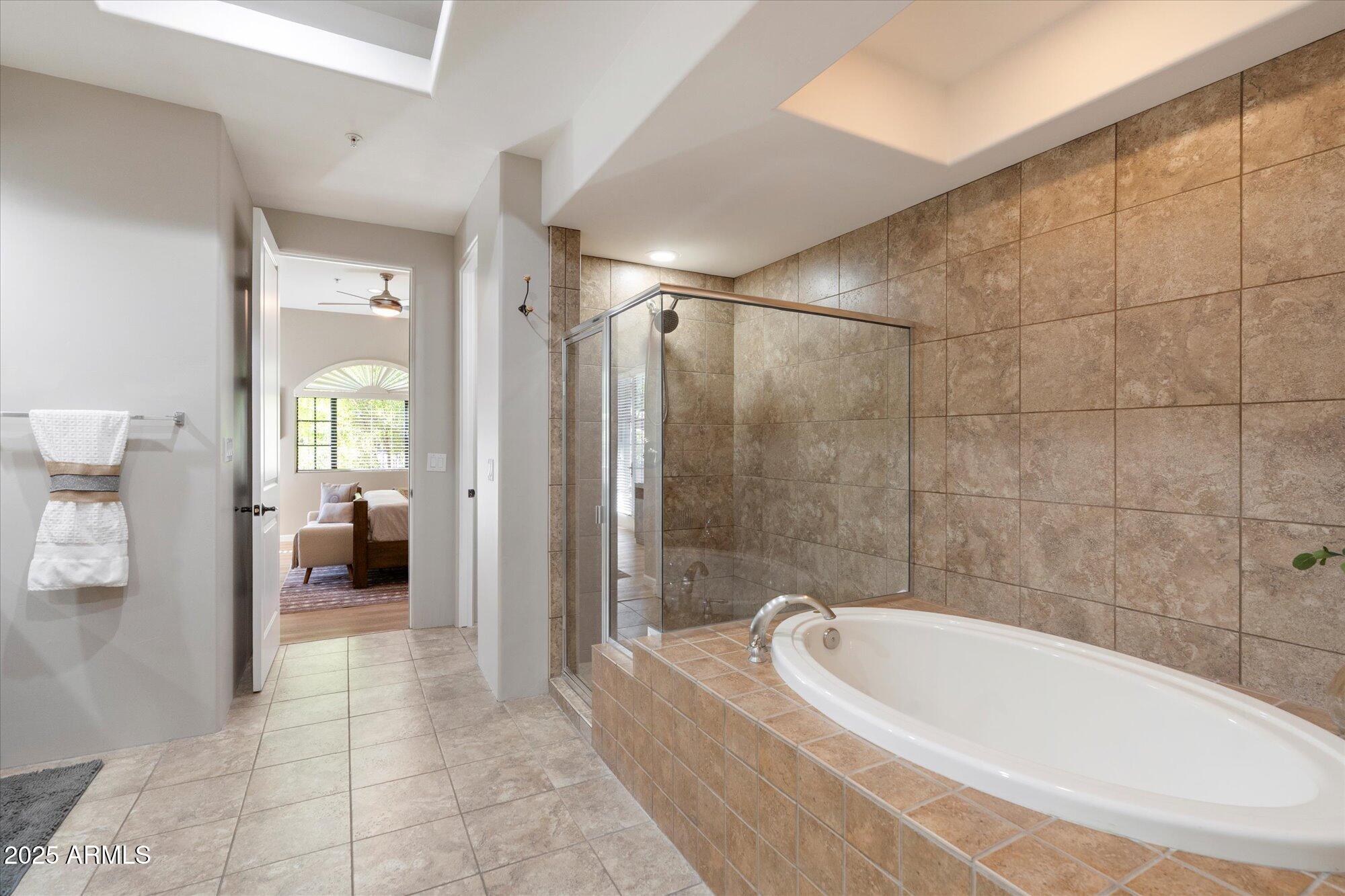 7200 East Ridgeview Place, Unit 9 Carefree, AZ 85377 - Photo 19 of 29 a bathroom with a bathtub and a shower