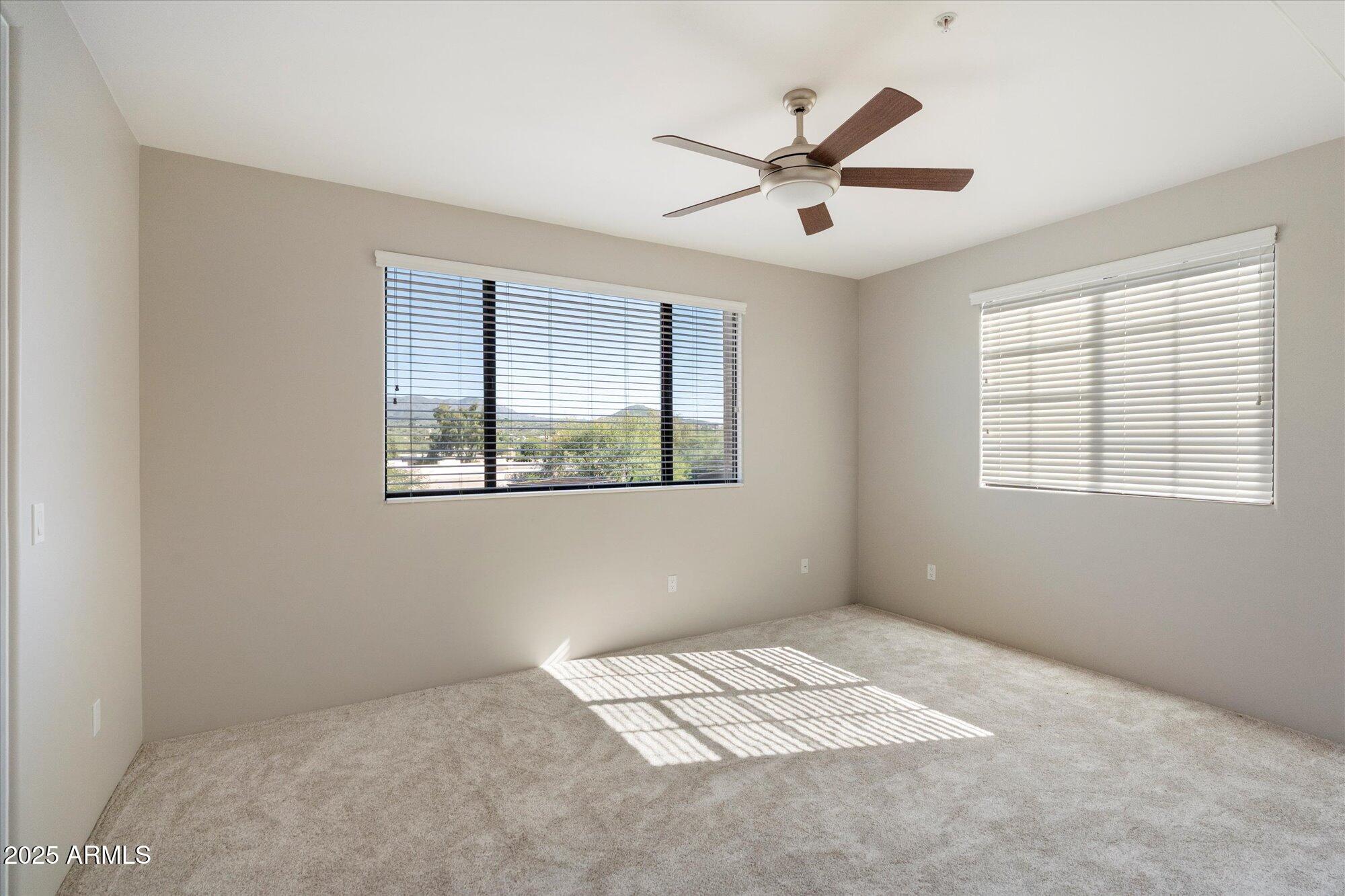 7200 East Ridgeview Place, Unit 9 Carefree, AZ 85377 - Photo 25 of 29 a view of an empty room with a window
