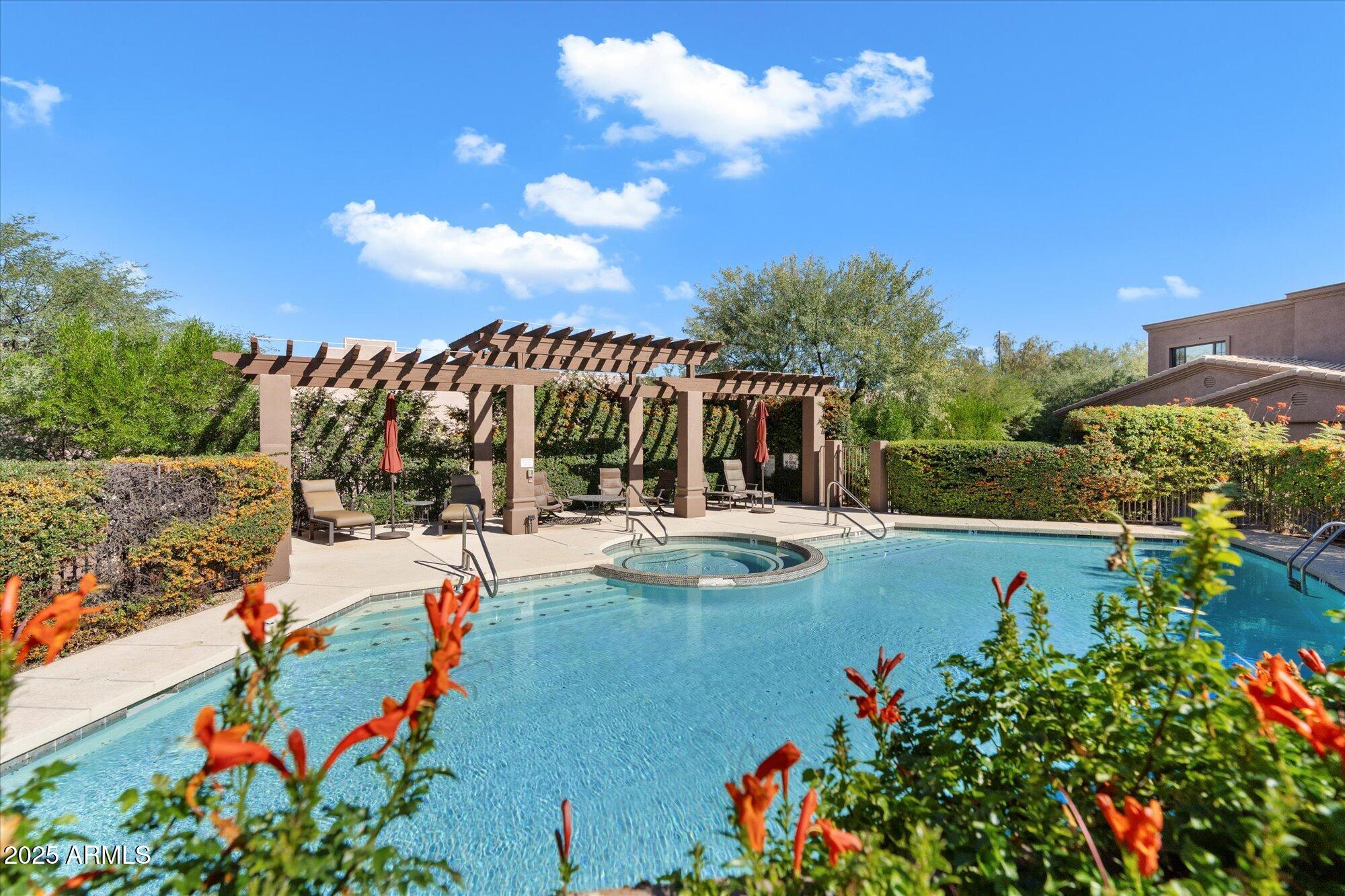 7200 East Ridgeview Place, Unit 9 Carefree, AZ 85377 - Photo 29 of 29 a view of swimming pool with outdoor seating and green space