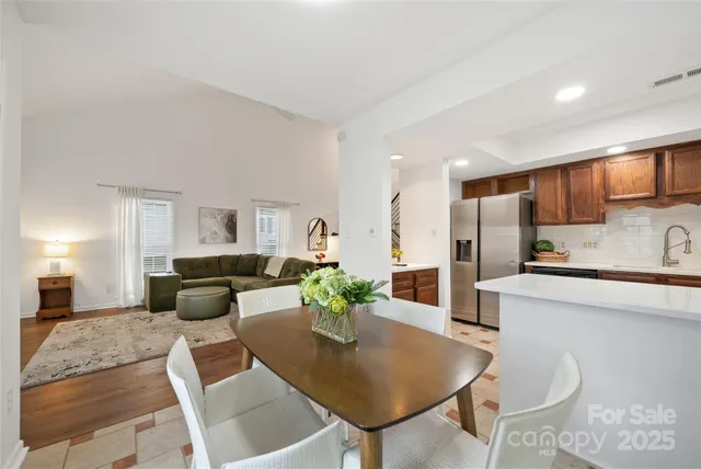 a living room with kitchen island furniture and a kitchen view