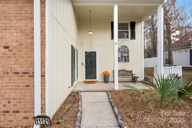 a lobby with furniture and potted plant