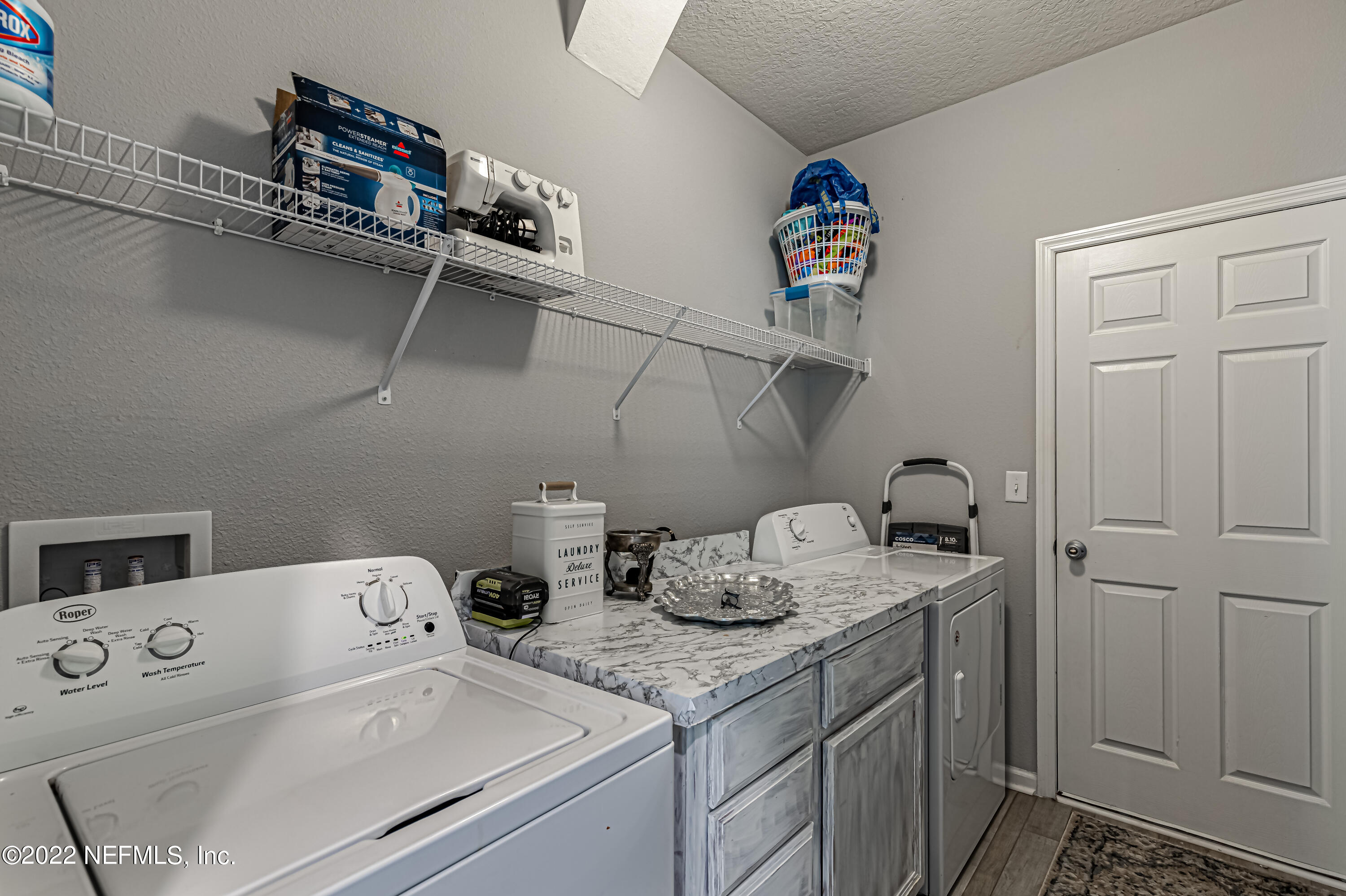 8220 Fouraker Forest Road Jacksonville, FL 32221 - Photo 14 of 56 LAUNDRY ROOM & GARAGE ENTRY