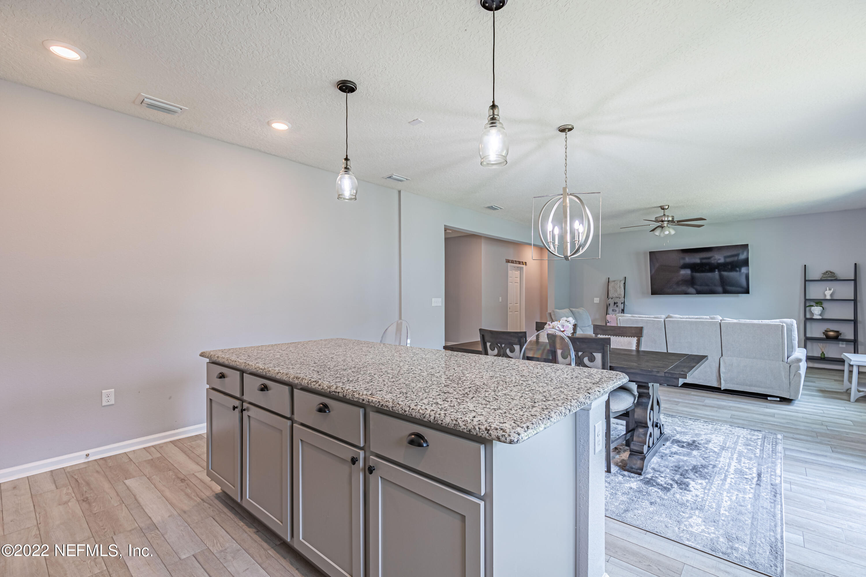 8220 Fouraker Forest Road Jacksonville, FL 32221 - Photo 24 of 56 KITCHEN ISLAND & VIEW OF GREAT ROOM