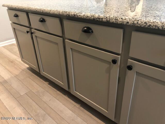 8220 Fouraker Forest Road Jacksonville, FL 32221 - Photo 30 of 56 KITCHEN ISLAND & TILE FLOOR