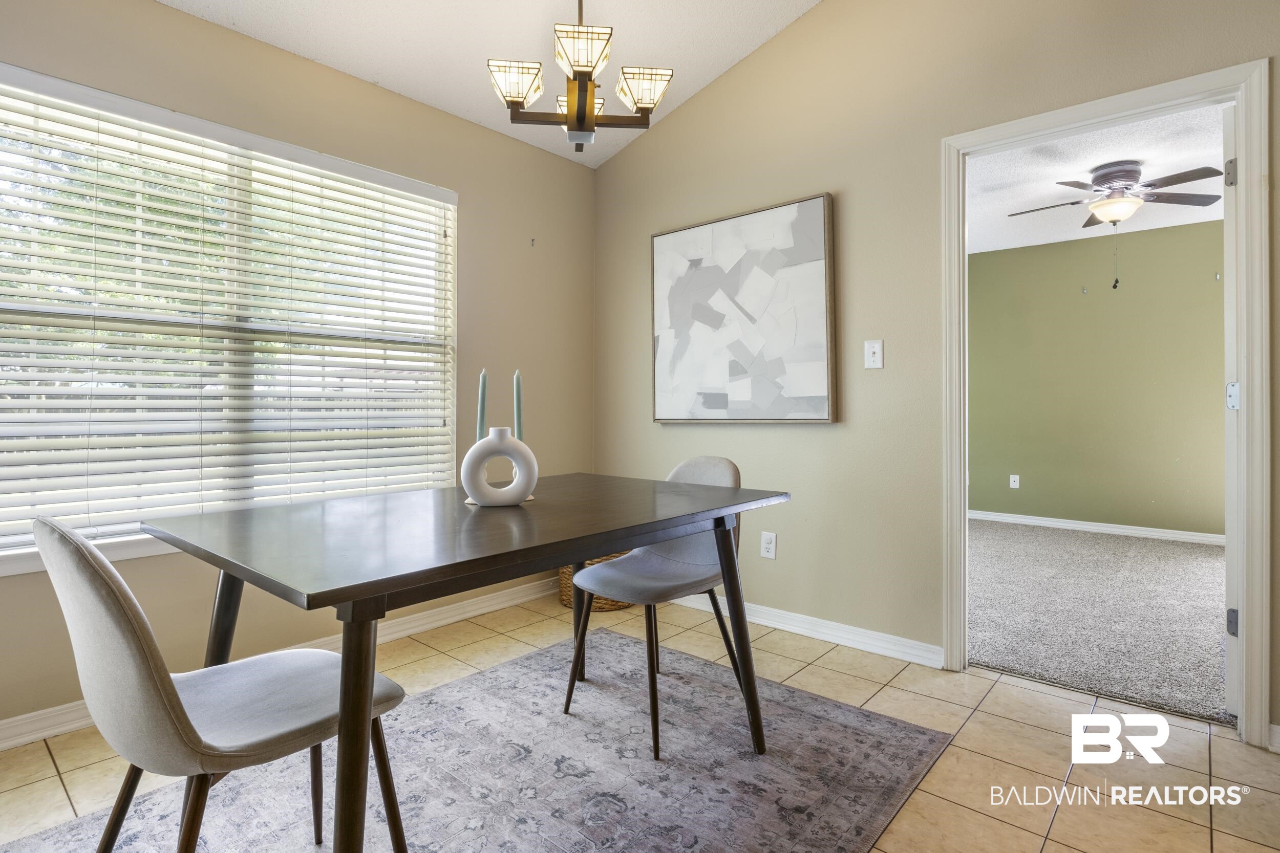 9610 Watkins Drive Fairhope, AL 36532 - Photo 4 of 26 Tiled office space with ceiling fan with notable chandelier and lofted ceiling