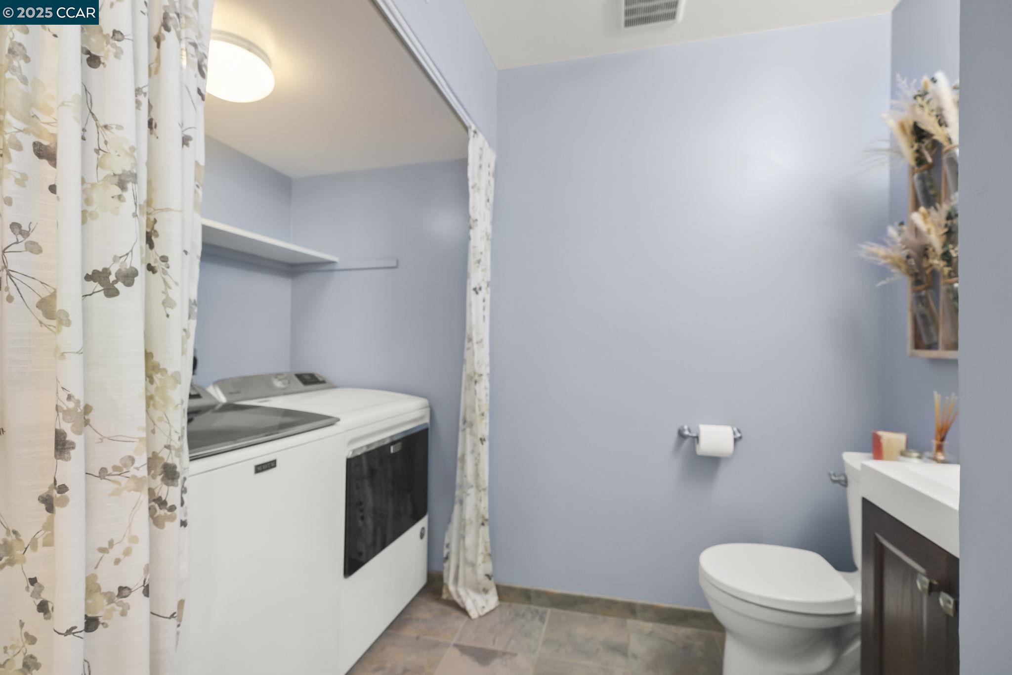 1435 Bel Air Drive, Unit C Concord, CA 94521 - Photo 11 of 25 a bathroom with a sink and a toilet