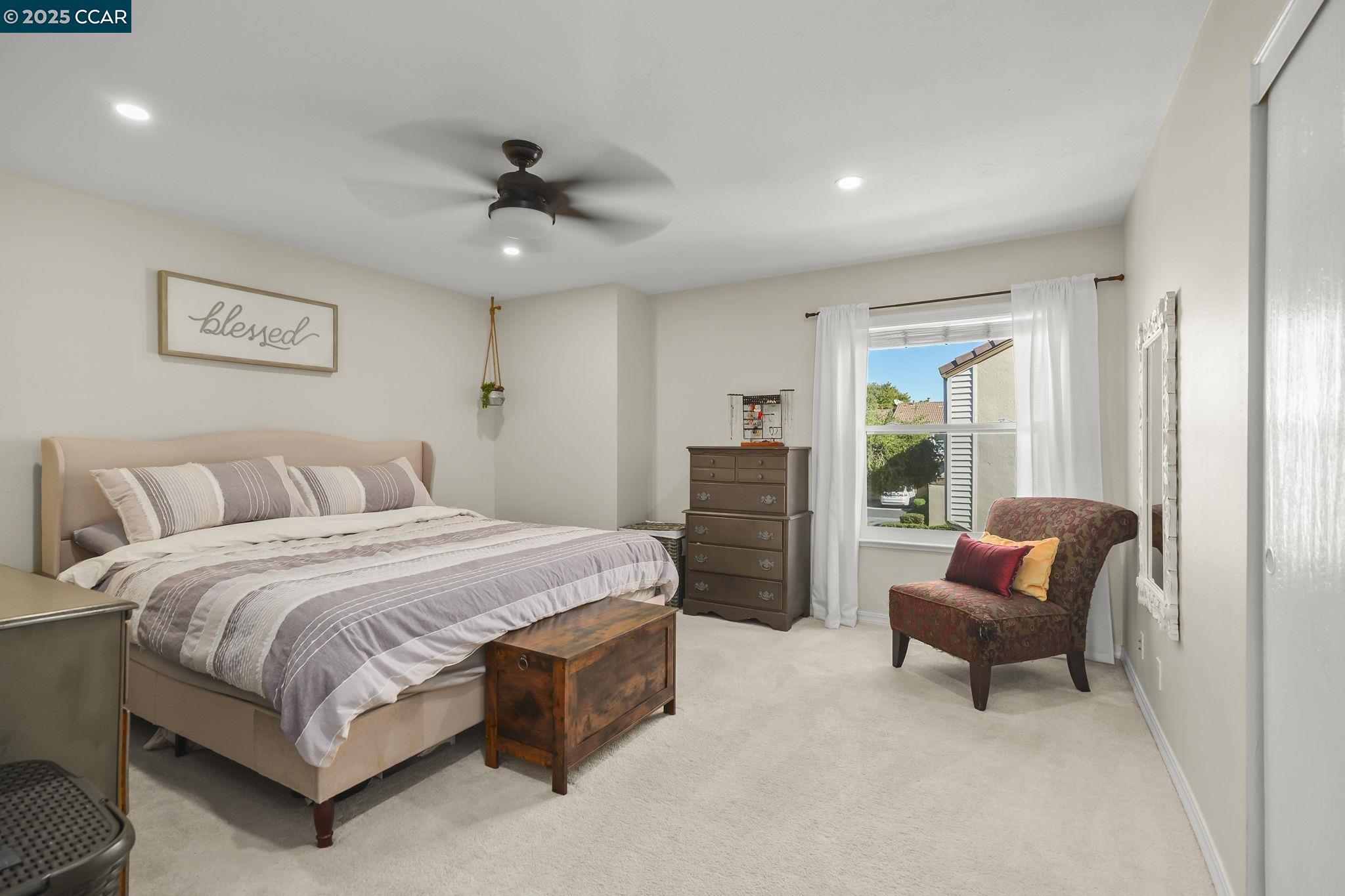 1435 Bel Air Drive, Unit C Concord, CA 94521 - Photo 13 of 25 a spacious bedroom with a bed and a window