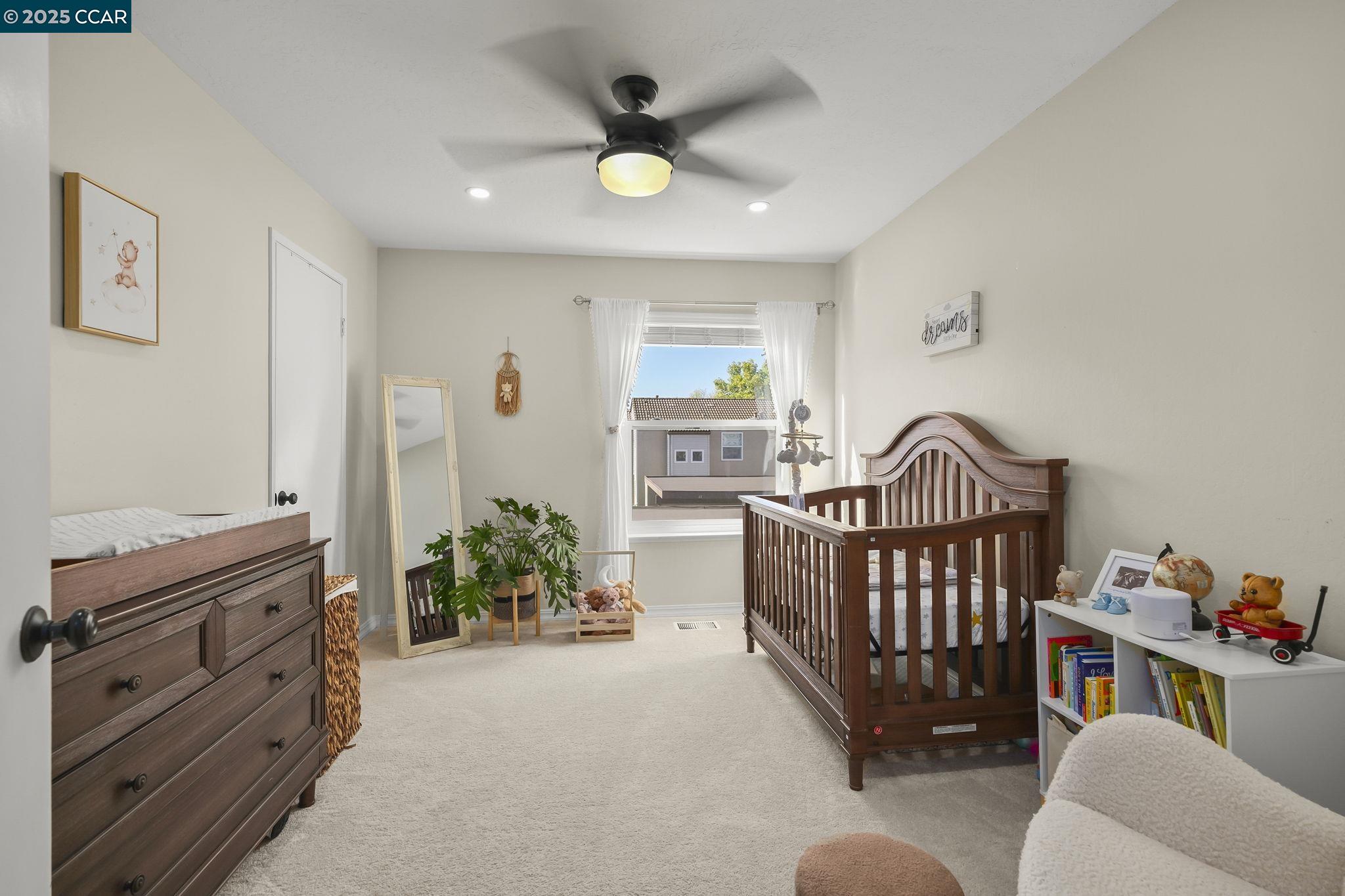 1435 Bel Air Drive, Unit C Concord, CA 94521 - Photo 14 of 25 a bedroom with furniture and a window