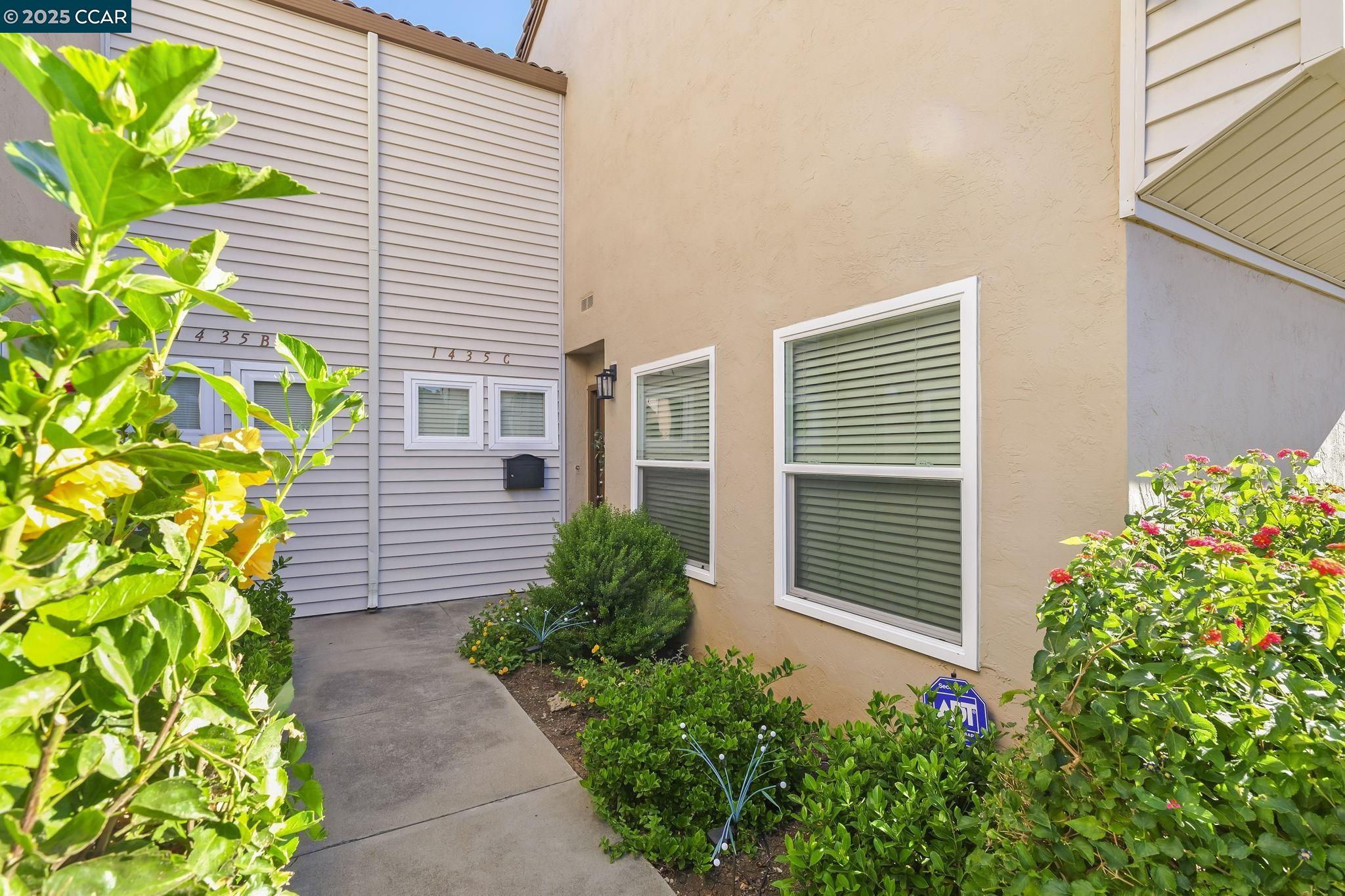 1435 Bel Air Drive, Unit C Concord, CA 94521 - Photo 20 of 25 a plant that is in front of a house