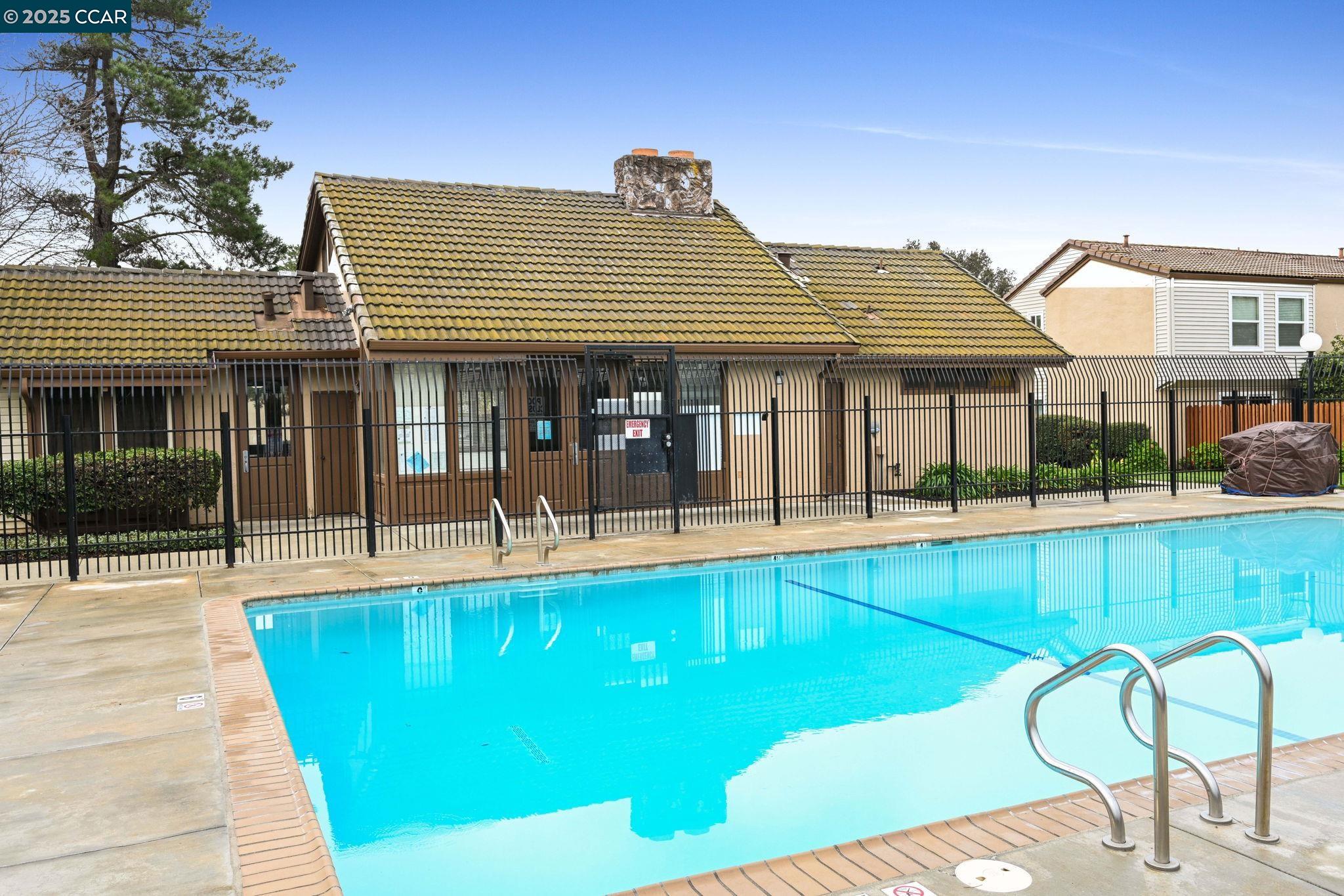 1435 Bel Air Drive, Unit C Concord, CA 94521 - Photo 22 of 25 a view of a patio with swimming pool table and chairs