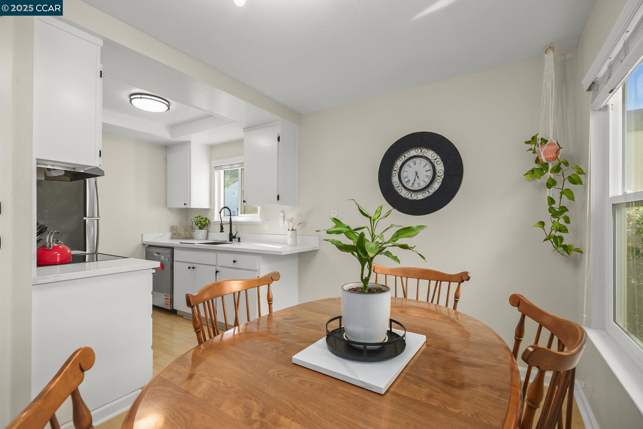 1435 Bel Air Drive, Unit C Concord, CA 94521 - Photo 8 of 25 a dining room with furniture a window and wooden floor
