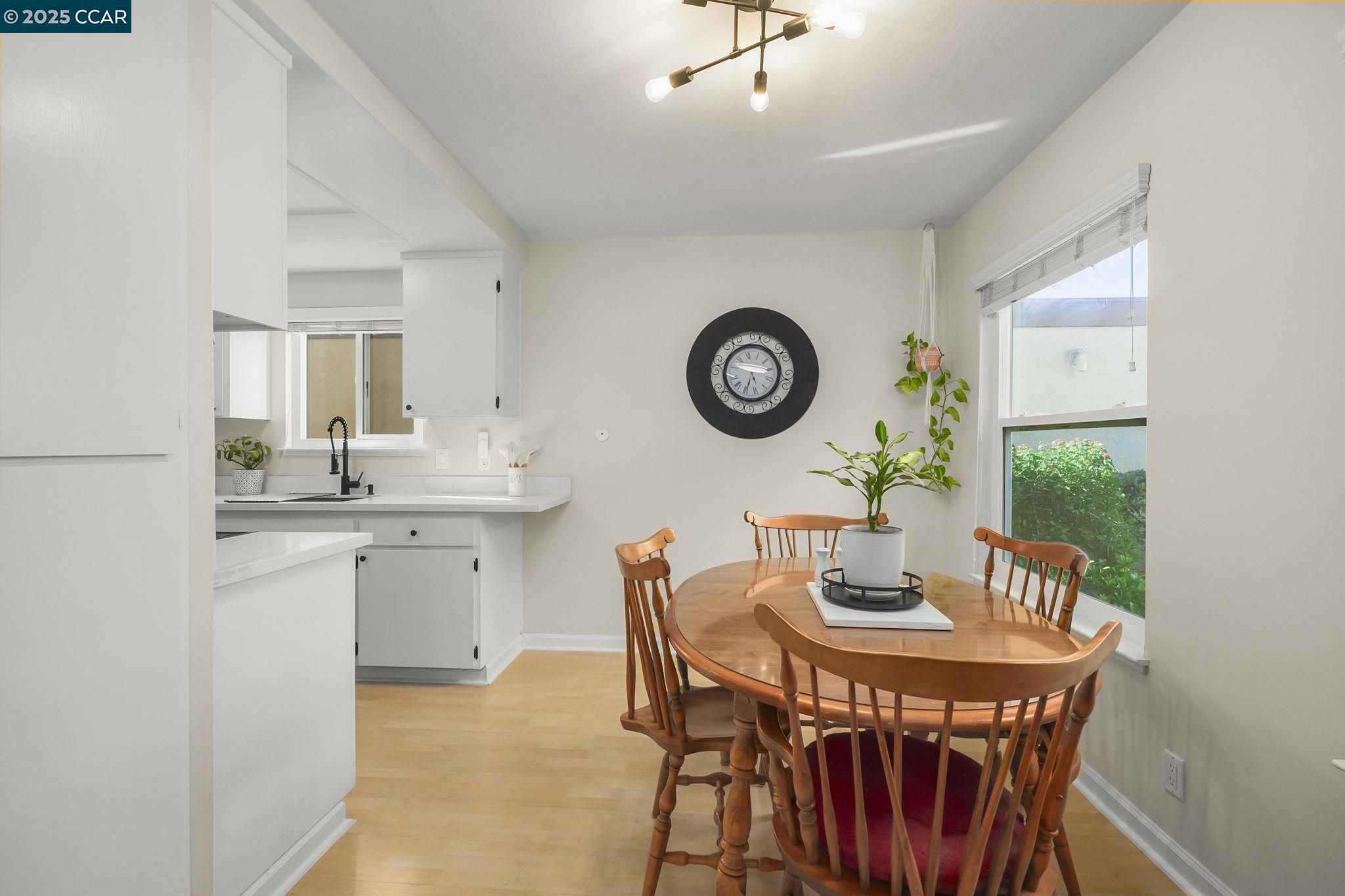 1435 Bel Air Drive, Unit C Concord, CA 94521 - Photo 9 of 25 a dining room with a wooden table and chairs