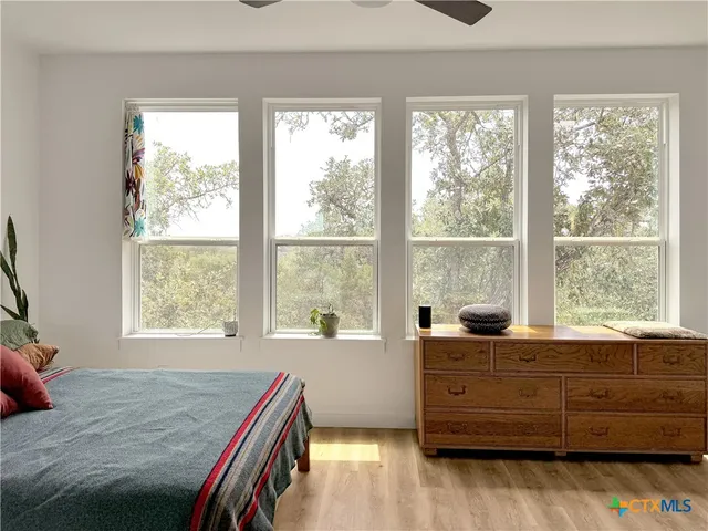 a room with a bed and a window