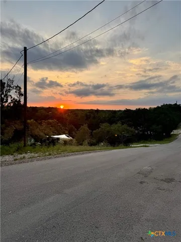 a view of a road with an ocean view
