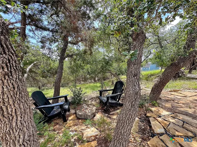a view of a city and green field