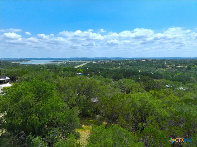 a view of house with yard and covered in snow