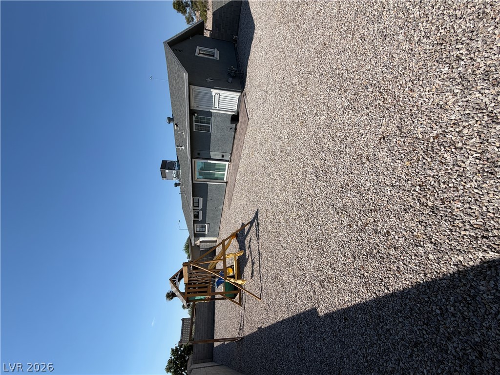A spacious gravel yard provides ample room for outdoor activities and future enhancements.