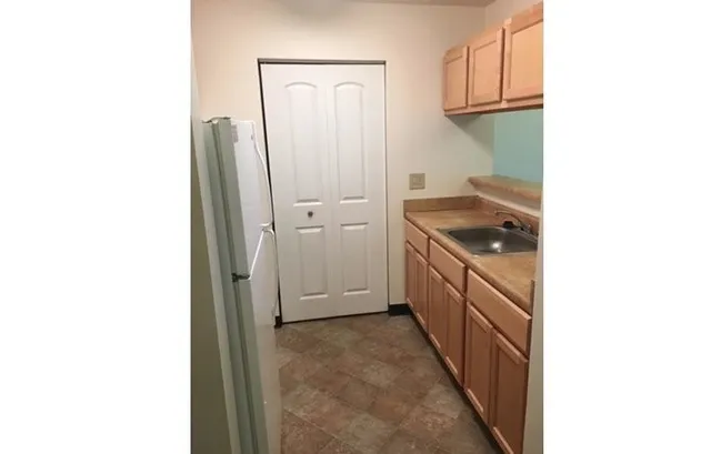 a kitchen with white cabinets
